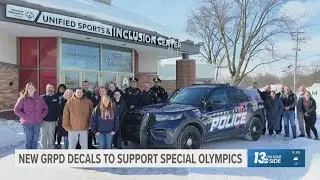 Grand Rapids police join Special Olympics Torch Run, unveil themed patrol car
