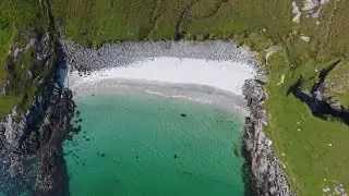 Beautiful beaches off the West Coast of Scotland from above in 4K, Vatersay, Barra, Eriskay & Tiree