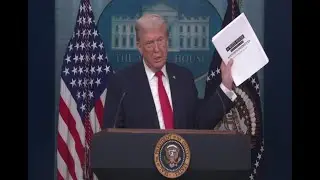 President Trump shows off book of his accomplishments so far