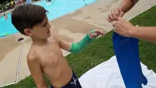 Alec swimming with waterproof cast cover