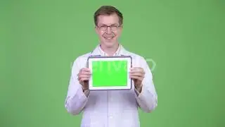 Happy Man Doctor Showing Chroma Key Green Screen Digital Tablet | Stock Footage - Videohive