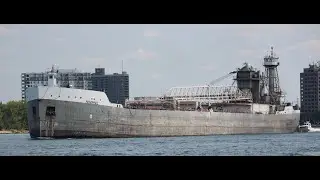 The Olive L. Moore tug boat built in 1928 and the Barge Menominee built in 1952.