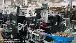 Automatic rewinding machine link with rotary die cutting and automatic paper core loading system
