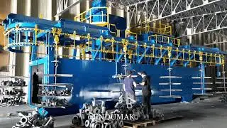 Overhead Rail Continuous Shot Blasting Machine