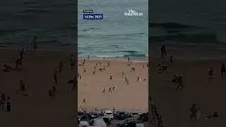 Surf camera in Australia shows beachgoers fleeing Bondi beach during shooting