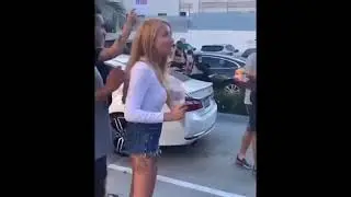 Eating a hamburger in front of animal rights protest