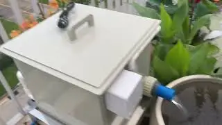 1320 gallon rotary drum filter set on a garden pool.