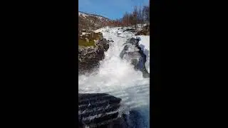 Slow motion view of a rushing stream in Northern Norway filled with meltwater - Spring has started:)