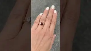 Ruby engagement ring in a emerald cut and trapezoid diamond sides