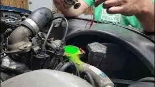 Fixing a leak at the thermostat housing on 6.5 diesel.