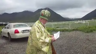 Archbishop David Mahaffey prayed at the Elders' Bell Tower in King Cove, Alaska on June 24, 2018.
