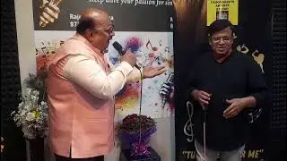 Doulat Phulwaniji and Arvindji presenting 