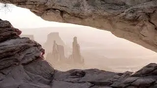 Rock Opening to Desert Landscape with Dust 4K Loop