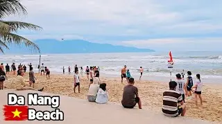 Lively Da Nang Beach with Crowds Relaxing by the Sea in A Beautiful Day Calm and Relaxing
