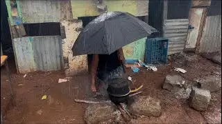 Cooking in the rain in an African village 