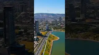 Vertical video. Izmir, Turkey. Aerial view of Park Ici Yolu promenade and Kordon walkway along Iz...