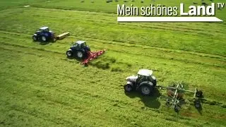 Treckerfahren zur Heuernte in Niedersachsen - abm&auml;hen, kreiseln, schwadern