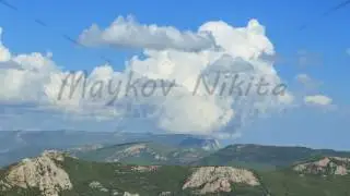 Clouds over the mountains, the south of the Crimea. Panorama. TimeLapse. 4K