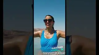 Woman Swimming in the Dead Sea on a Sunny Day
