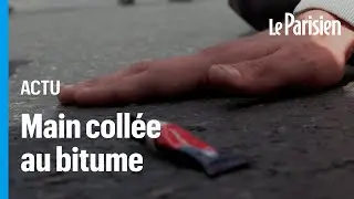 Des militants &eacute;colos se collent la main au bitume avec de la glu, des automobilistes en col&egrave;re