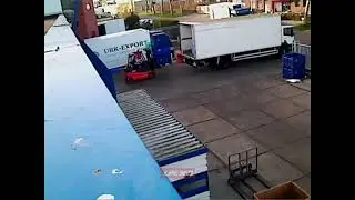 Forklift worker flips crate with fish