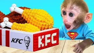 Monkey Baby Bon Bon with the ducling work together on a cardboard puzzle challenge