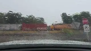 Southbound UP train with 54 freight cars in the rain in Cambridge, Iowa on the Spine Line