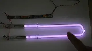 Striations in low pressure gas discharge