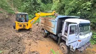 jcb loading sand gravel into a dump truck