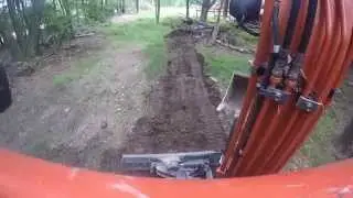 Excavation Contractor working - grading, digging