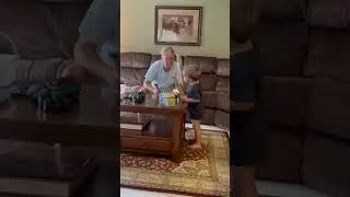 Grandpa&rsquo;s boy learning from grandpa. Grandpa is an expert.