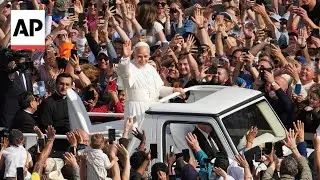 Pope Leo XIV takes his first popemobile ride through St. Peter's Square