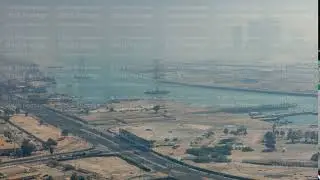 Skylines under the thick fog at the street timelapse of Abu Dhabi at morning