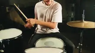 Drummer performing in the studio