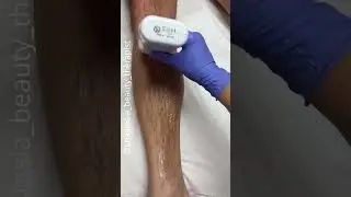 Male lower leg wax service using coral roll on soft wax cartridge system from Starpil