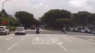 Cyclist dangerously cycling across the road even when pedestrian crossing is red