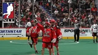 Calgary's Shawn Evans circles around the net to fight in a no-look goal