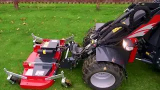 Finnischer Minilader im Einsatz mit Rasenmäher