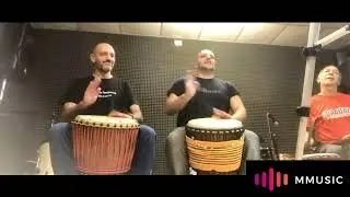 Afro djembe session training in music room - be happy, play DRUM