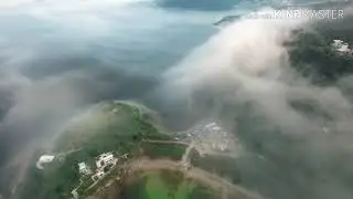 Natural beauty of sea and mountain in between the clouds