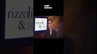 angie harmon In Open Black Shirt With A Black Pantsuit With A Belt 
