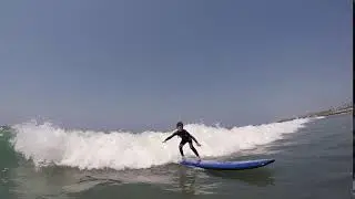 Grom charging surf lesson