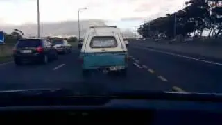 Unroadworthy, smoking old pickup on N2 near Cape Town