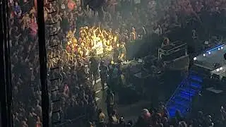 Mike trades hats with kid, sings 