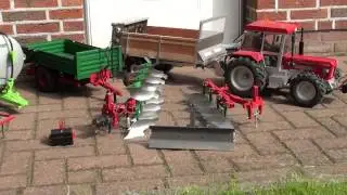 RC Schl&uuml;ter 1250 mit Anbauger&auml;te im Ma&szlig;stab 1:10