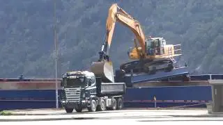 OurTour marvel at Norwegian logistics - materials for roadworks arriving by boat on Hardangerfjord