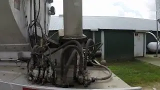 unloading feed at a farm