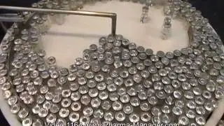 Labelling Machine for labeling on penicillin  vials. Video 1164 www.Pharma-Manager.com
