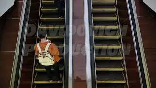 Moscow metro passengers riding escalator, daily commuting in urban setting