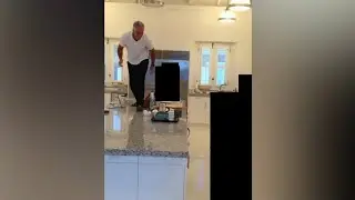 Disturbing new video shows Epstein chasing women around the kitchen of his island home